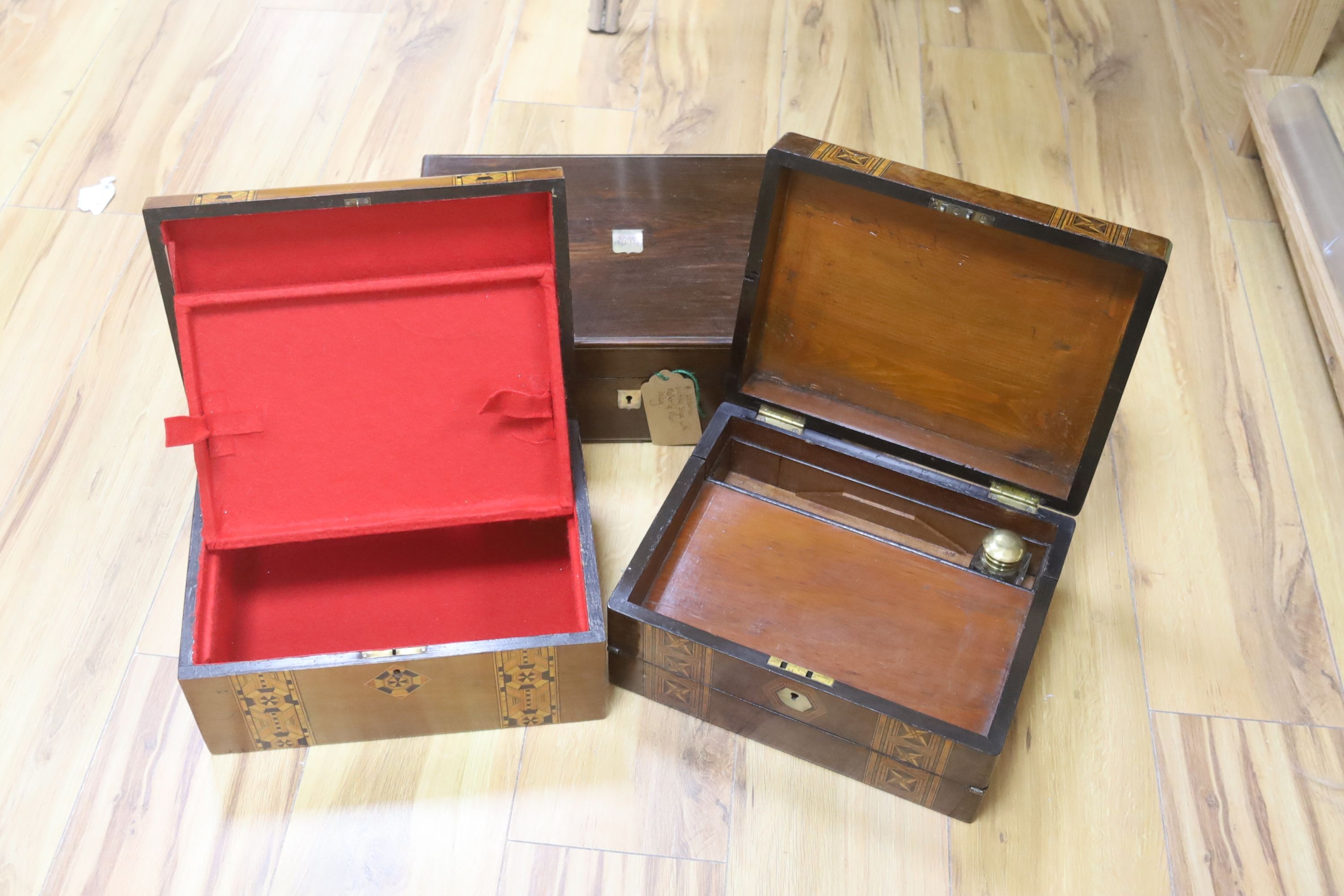 A Victorian rosewood writing box and two Victorian walnut and parquetry boxes